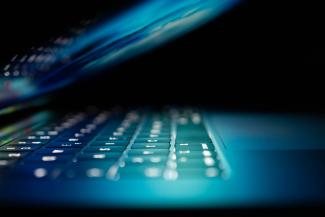closeup photo of turned-on blue and white laptop computer by Philipp Katzenberger courtesy of Unsplash.